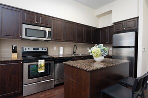 Family Condo | Private kitchen | Full-size fridge, microwave, oven, stovetop