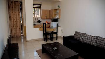 Classic Apartment, Hill View | Living area | Flat-screen TV