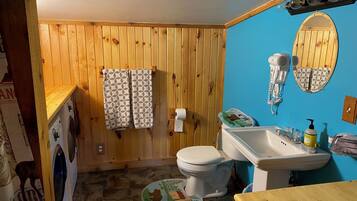 Shower, towels, soap, toilet paper