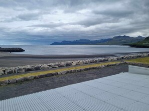 On the beach, black sand