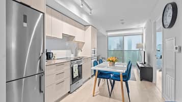 Deluxe Apartment, Multiple Beds | Private kitchen | Full-size fridge, microwave, oven, stovetop