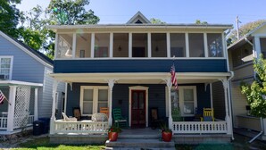 A two-story house with a porch, a front door, and an American flag. - 344 Maple in Lakeside (Lakeside)