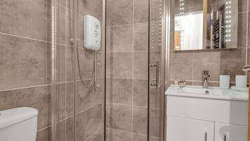 Shower, hair dryer, towels, soap