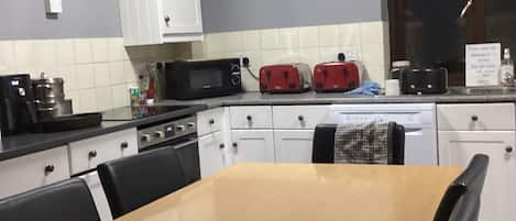 Fridge, microwave, stovetop, cookware/dishes/utensils