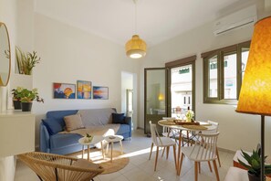 Comfort Apartment | Living area | 43-inch Smart TV with cable channels - Elartis Apartment (Chania)