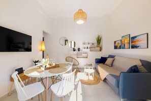 Comfort Apartment | Living area | 43-inch Smart TV with cable channels - Elartis Apartment (Chania)
