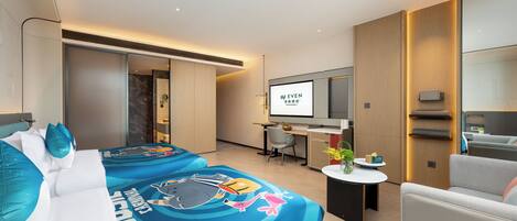 A modern hotel room with two beds, a desk, a TV, and a seating area.
