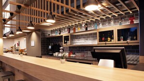 A modern bar area with wooden ceiling beams, pendant lighting, and a bar counter with stools. - Holiday Inn Express & Suites Monheim Am Rhein by IHG (Monheim)