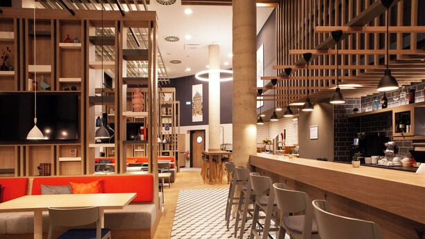 A modern restaurant with a bar area, seating, and a large TV screen. - Holiday Inn Express & Suites Monheim Am Rhein by IHG (Monheim)