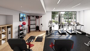 A modern gym with treadmills, exercise balls, and weight machines. - Staybridge Suites Southaven Memphis South by IHG (Southaven)