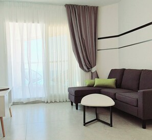 Luxury Suite, Balcony, Sea View | Living area - 8Go to Leonardo apartments (Bat Yam)