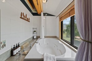Shower, jetted tub, towels, soap