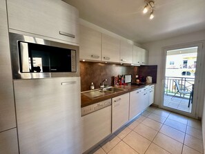 Fridge, dishwasher, toaster, cookware/dishes/utensils