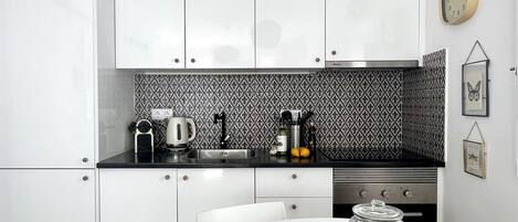 Fridge, oven, coffee/tea maker, cookware/dishes/utensils