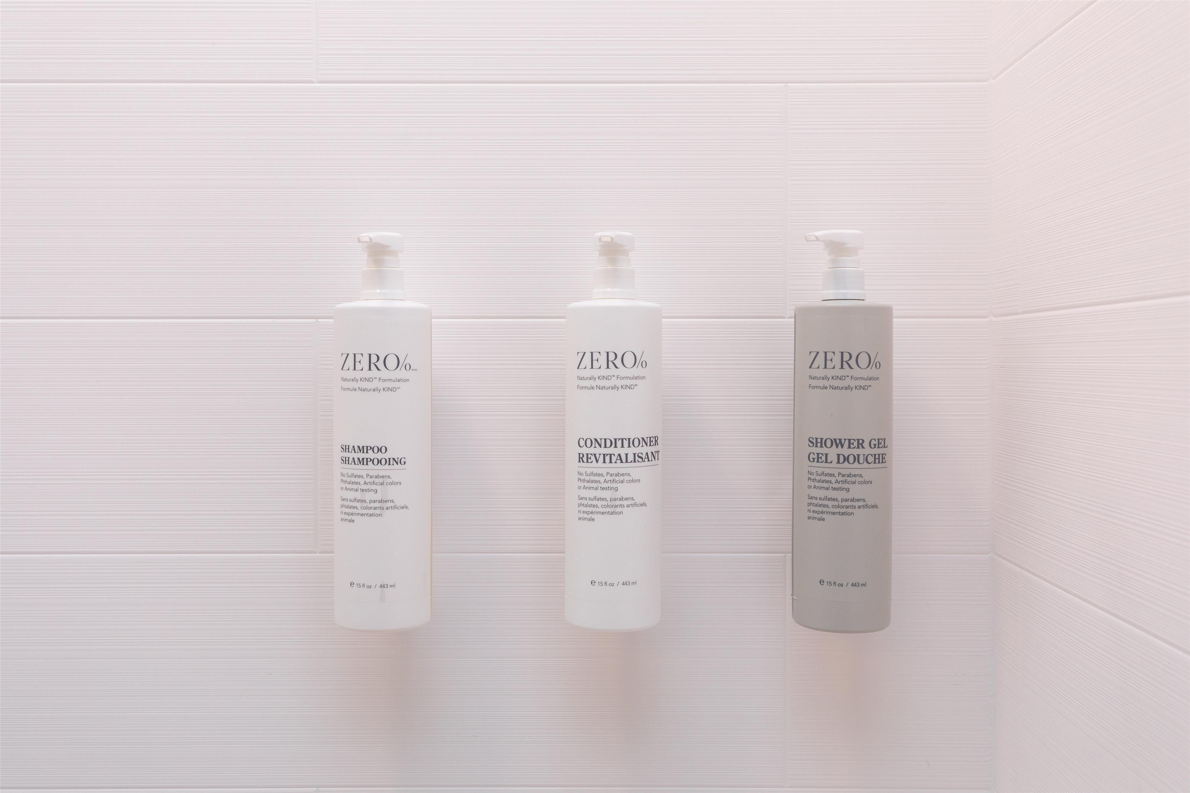 Three bottles of ZERO® products: SHAMPOO, CONDITIONER, and SHOWER GEL, each labeled with 'Naturally KNO® formulation' and 'No animal testing'.