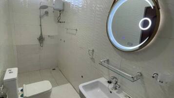 Shower, towels, toilet paper