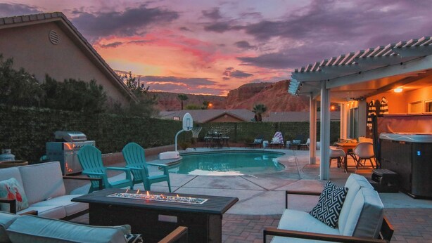An outdoor patio with a pool, seating, and a barbecue area. - Heated Pool at Turtle Cove Sleeps 12 (Mesquite)