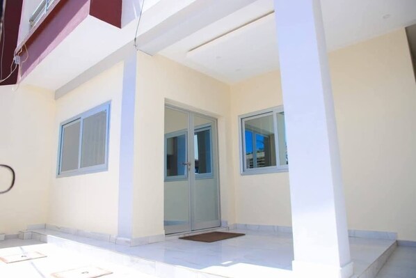 Stylish exterior with three windows and a flat roof.