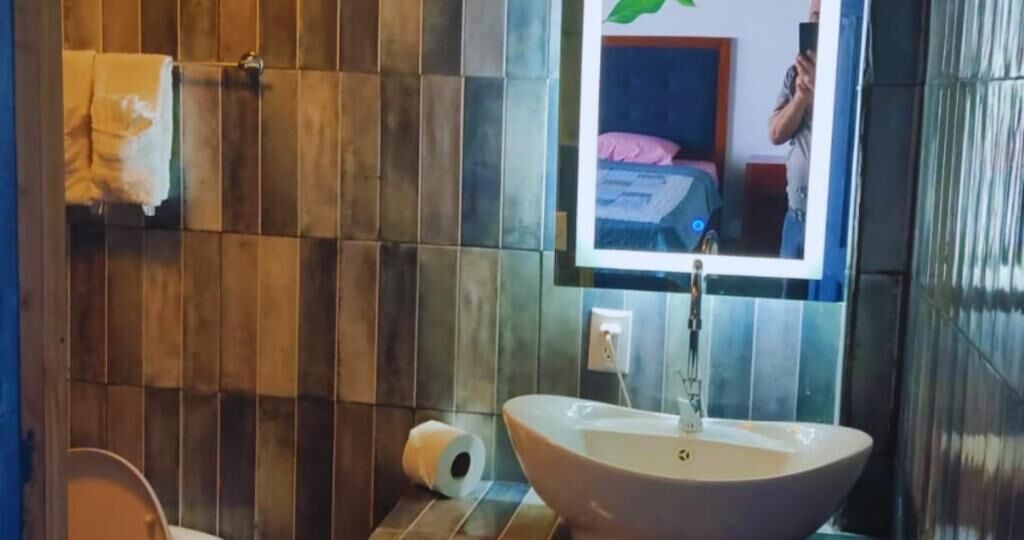 Shower, rainfall showerhead, towels, soap