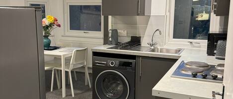 Fridge, microwave, oven, cookware/dishes/utensils