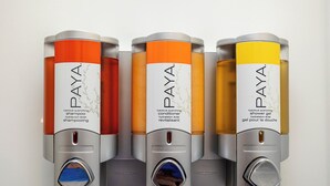 Four cylindrical containers of Paya hair care products.