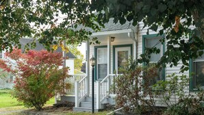 A house with a porch, a front door, and a mailbox. - *NEW*Hops House-Sleeps10-8Mi.toCDP&15Mi.toASV (Hartwick)