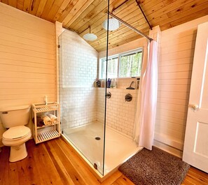 Shower, towels, soap, toilet paper