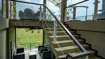 Deluxe Double Room, Garden View | Living area | TV