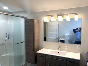 Shower, hair dryer, towels, soap