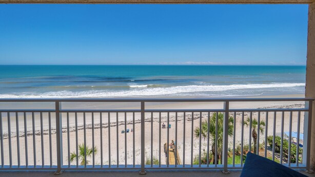 A balcony with a view of the beach and ocean. - Oceanfront 2BR Condo with Stunning Ocean Views and Beach Access, 505 (Indian Harbour Beach)