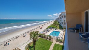 A hotel balcony with a view of the beach and ocean. - Oceanfront 2BR Condo with Stunning Ocean Views and Beach Access, 505 (Indian Harbour Beach)