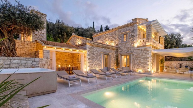 A stone villa with a pool, outdoor seating, and a bar area. - Ionian Stone Luxury Villas in Corfu - Estate (Corfu)