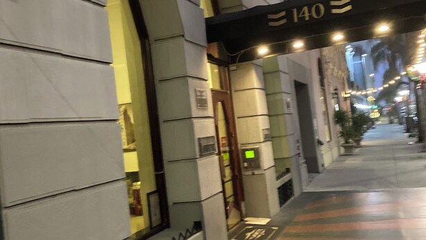 A building entrance with a sign reading "140" and a covered walkway. -  1-bedroom condo in Long Beach with 2 private patios.  (Long Beach)