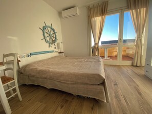 1 bedroom - Wind, sun and sea breeze await you   (Badesi)