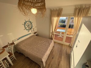1 bedroom - Wind, sun and sea breeze await you (Badesi)