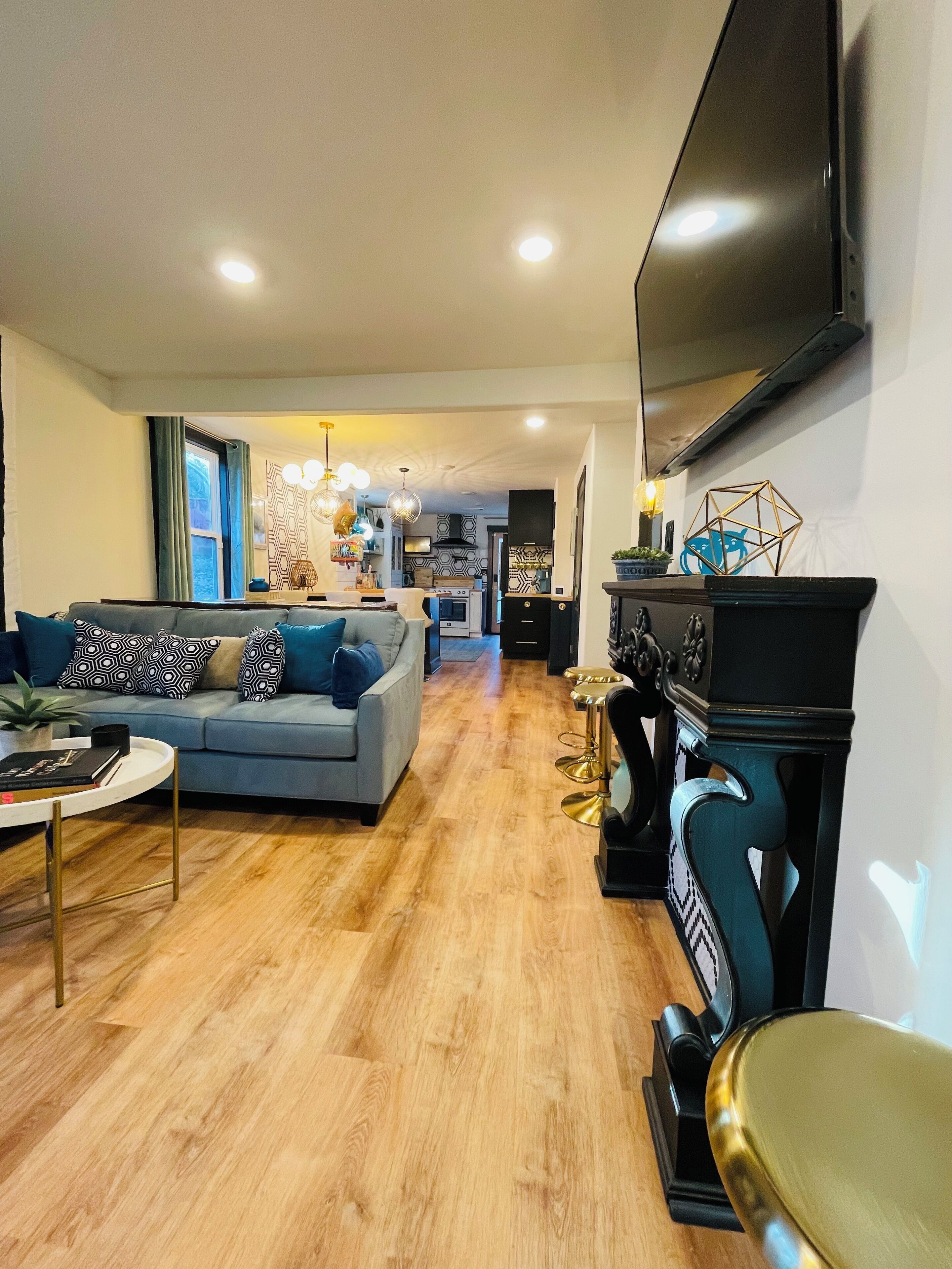 Smart TV, fireplace, books, computer monitors