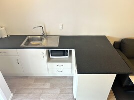 Family Apartment, 2 Bedrooms | Private kitchen | Mini-fridge, microwave, toaster, cookware/dishes/utensils