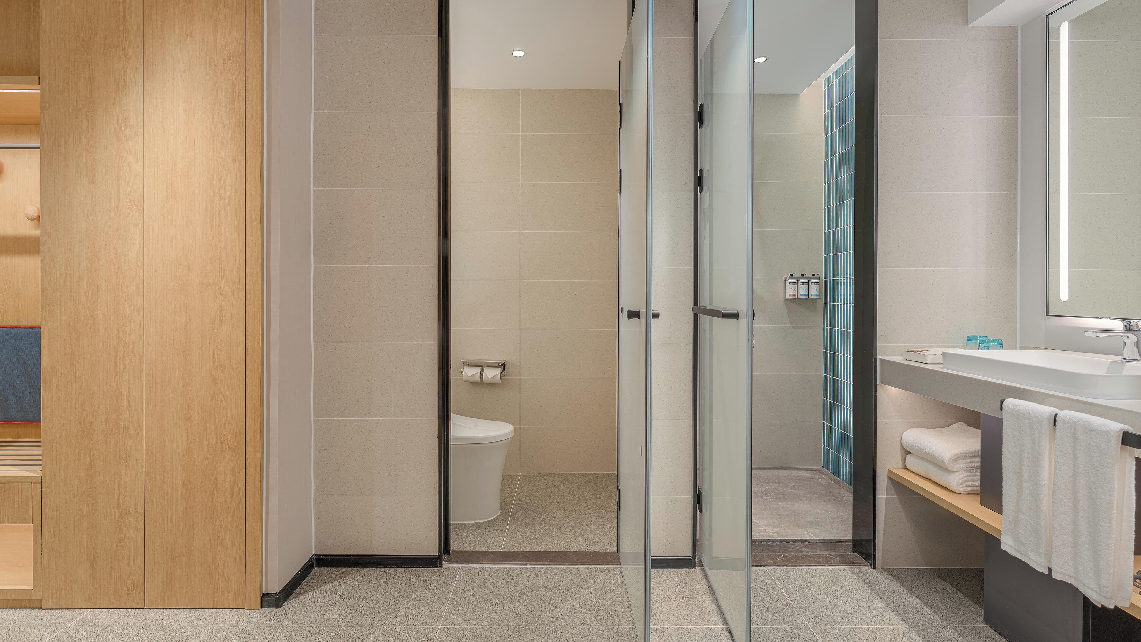 1 Bedroom Suite Stocked Minibar | Bathroom | Shower, hair dryer, slippers, towels