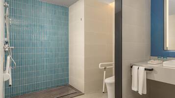 1 King Standard Accessible | Bathroom | Shower, hair dryer, slippers, towels
