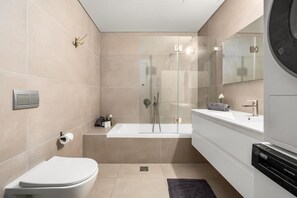 Shower, hair dryer, towels, soap