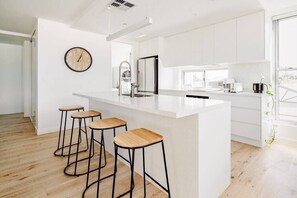 Fridge, coffee/tea maker, cookware/dishes/utensils