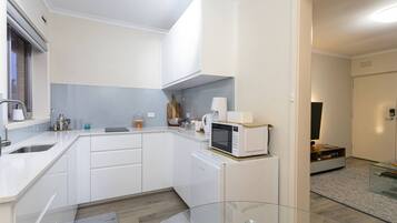 Fridge, microwave, stovetop, cookware/dishes/utensils