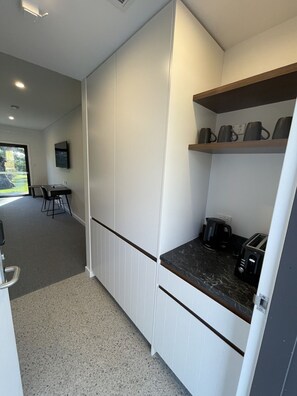 Standard Quadruple Room, Patio, Golf View | Desk, laptop workspace, blackout curtains, soundproofing - Harden Country Club Motel (Harden)