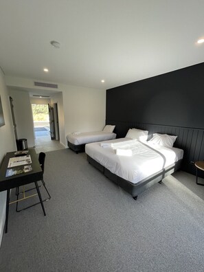 Deluxe Quadruple Room, Patio, Golf View | Desk, laptop workspace, blackout curtains, soundproofing - Harden Country Club Motel (Harden)