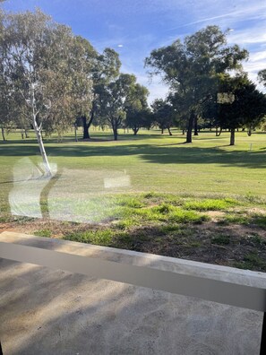 Deluxe Quadruple Room, Patio, Golf View | Desk, laptop workspace, blackout curtains, soundproofing - Harden Country Club Motel (Harden)