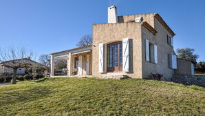 A two-story house with a stone facade, a chimney, and a covered porch. - Awesome home in Saint-Laurent-du-Verdo (Saint-Laurent-du-Verdo)