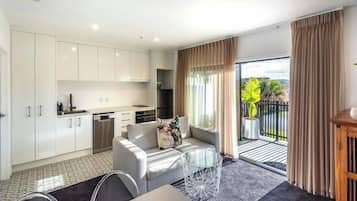 Deluxe Suite | Living area | 50-inch Smart TV with digital channels, Netflix, streaming services