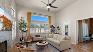 A modern living room with a sofa, chairs, a coffee table, and a fireplace. - Scottsdal:  Pool , 2BR/2BTH - Elegant! (Scottsdale)