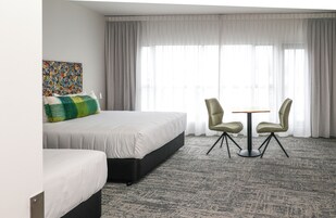 Premium bedding, pillow-top beds, blackout curtains, soundproofing