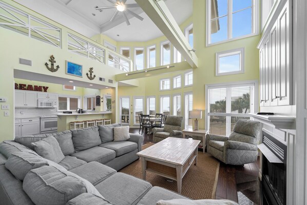 Signature House, 6 Bedrooms, Balcony, Beach View | Living room | 65-inch Smart TV with cable channels, fireplace